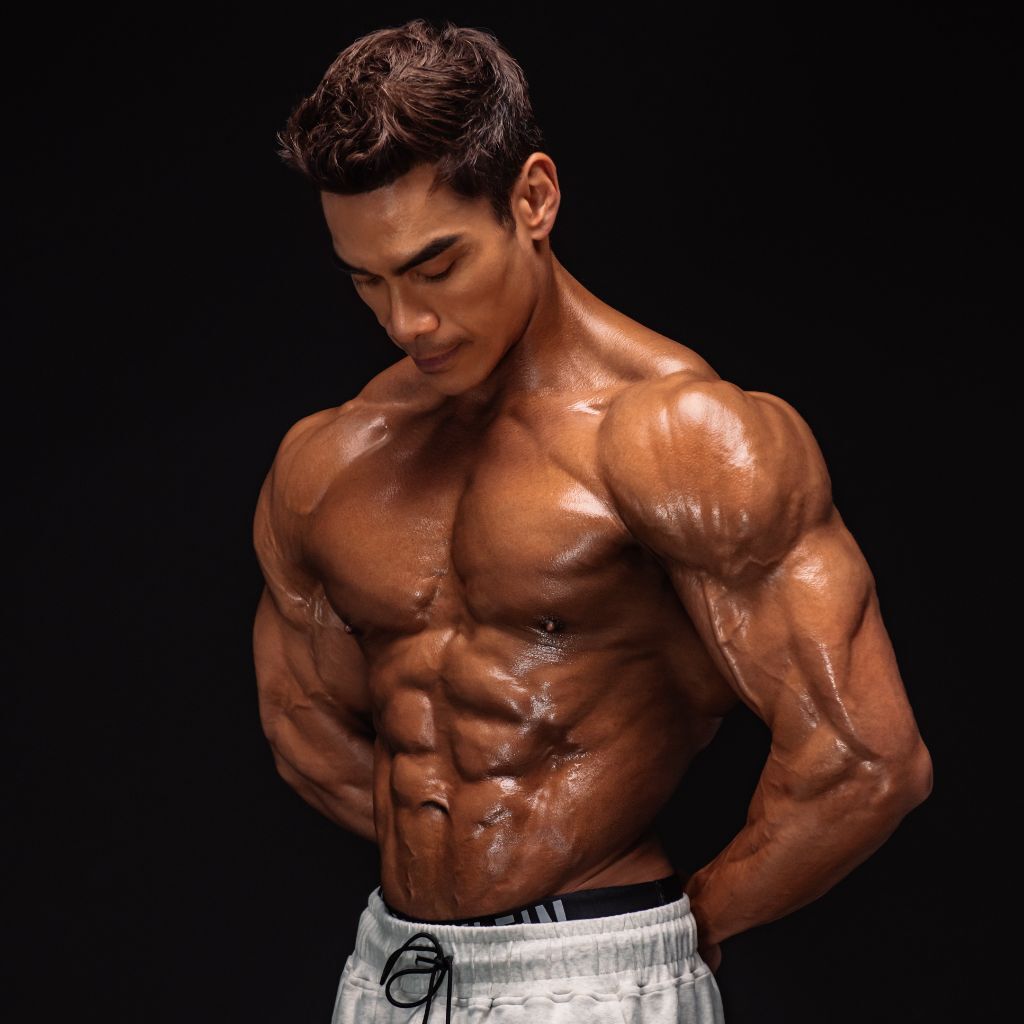 Adrian training a client in the gym